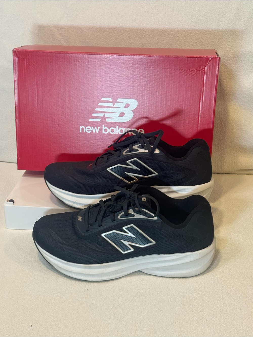 Women’s New Balance 680 v9 Athletic Shoes in Black with Rose Gold accents.